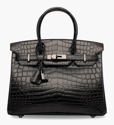 A rare, matte black niloticus crocodile So Black Birkin 30 with black hardware. Hermès, 2010. 30 x 22 x 15 cm. Estimate HK$300,000-400,000. This lot is offered in Handbags & Accessories  on 31 May 2017 at Christie’s in Hong Kong

An already sought-after crocodile Birkin becomes even more exclusive with its limited-production So Black hardware.