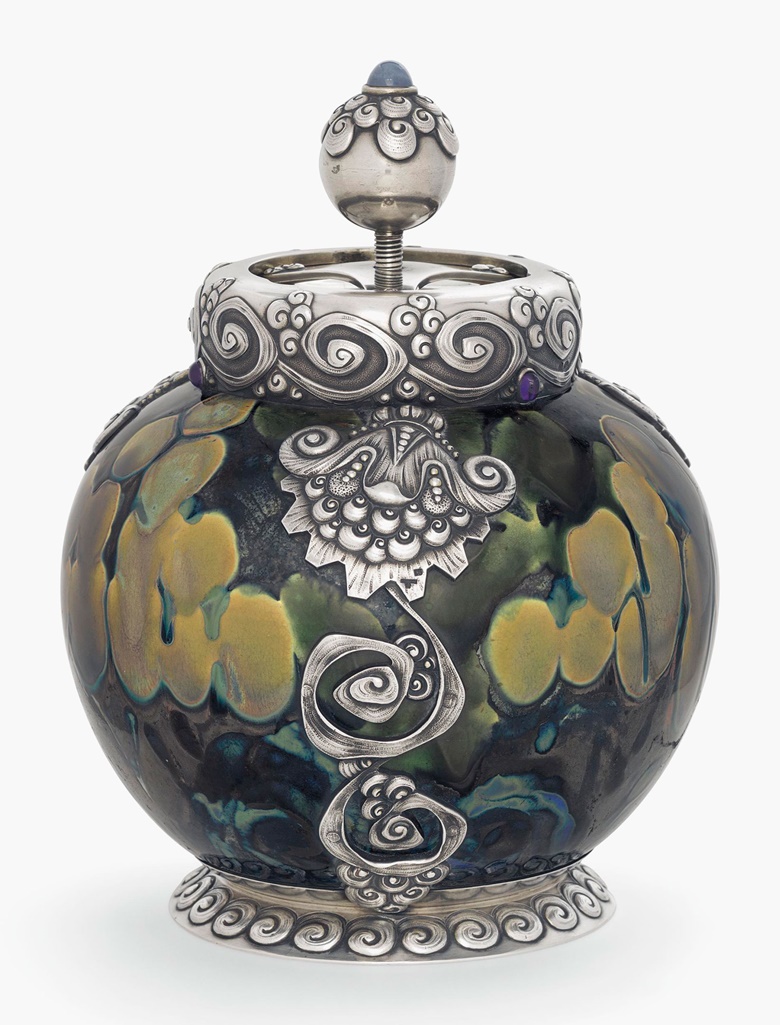 A gem-set parcel-gilt silver-mounted ceramic tobacco humidor, the mounts marked K. Fabergé with the imperial warrant, Moscow, 1899-1908, scratched inventory number 15515; the body by the Imperial Stroganov School, Moscow. Sold for £134,500 on 6 June 2016 at Christie’s London