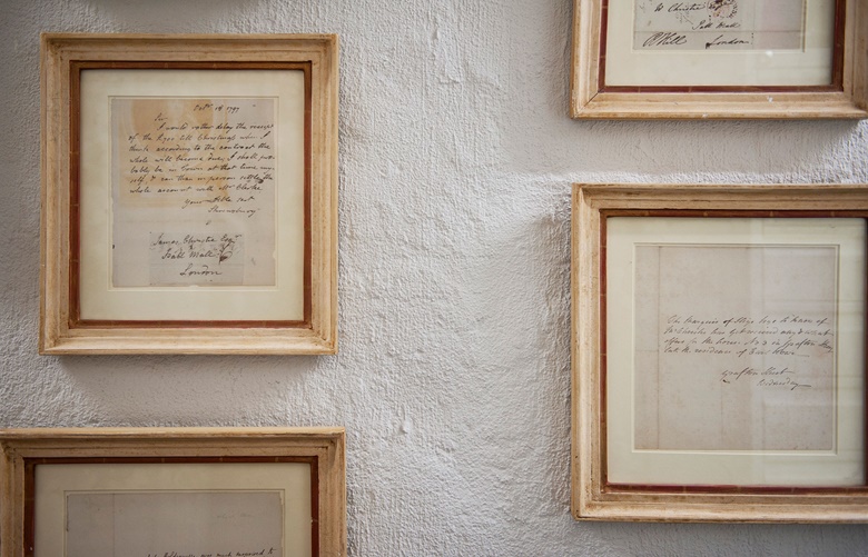 Framed correspondence from James Christie lines the walls of the archives