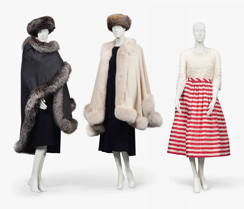 Four fox fur-trimmed cashmere wraps (two shown). By Zwirn, two by Denis Basso and one unlabelled. Estimate £800-1,200. A dinner dress. Probably by Pierre Balmain, unlabelled. Estimate £1,000-1,500. These lots are offered in The Collection of Raine, Countess Spencer on 13 July 2017 at Christie’s in London, King Street