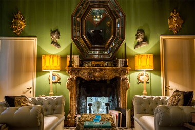 The Green Sitting Room at Casa Fornasetti in Milan, and detail of guest room with marine theme. Photos courtesy Fornasetti