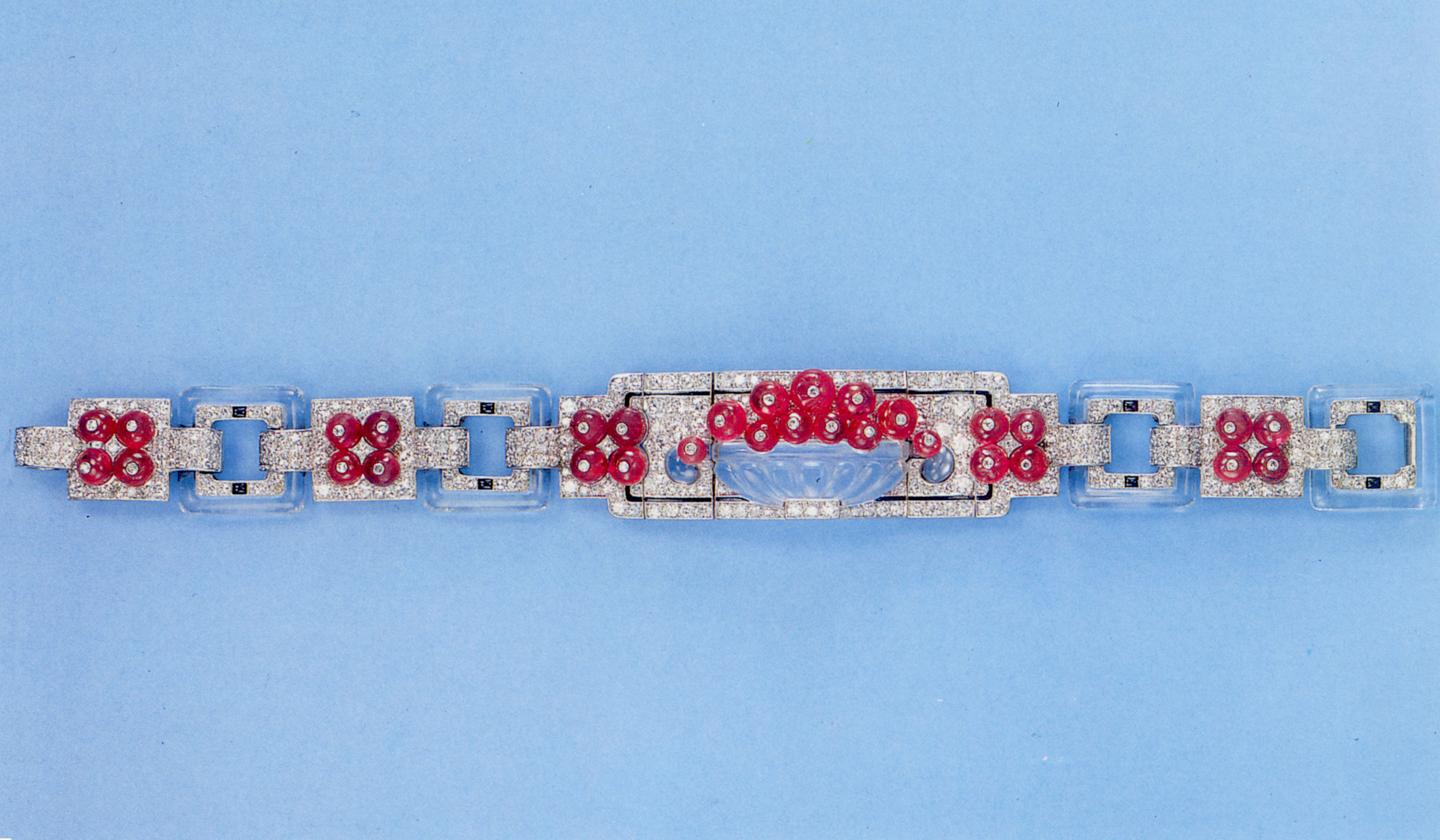 An exquisite Art Deco ruby, diamond, rock crystal and black enamel bracelet, by Cartier, circa 1925. Sold in our Jewellery by Cartier sale on 21 May 1992 at Christie’s in Geneva