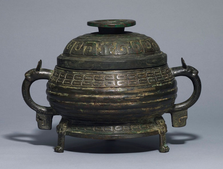 A bronze ritual tripod food vessel and a cover, gui, Western Zhou dynasty (1100-771 BC). 13¾ in (34.9 cm) wide. Estimate £50,000-80,000. This lot is offered in Fine Chinese Ceramics & Works of Art on 7 November 2017  at Christie’s in London