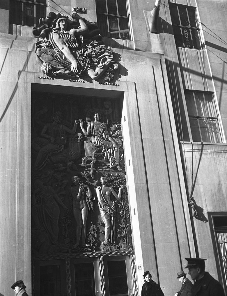 Alfred Janniot created the gilt relief above the entrance door of La Maison Francaise (main entrance of 610 Fifth Avenue). It is called Friendship Between America and France, 1934. Above Friendship Between America and France is Janniot’s  Gallic Freedom. Photo William J. RoegeThe New York Historical SocietyGetty Images © ADAGP, Paris and DACS, London 2018