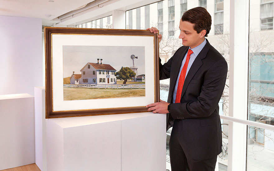 William Haydock, Christie’s American Art specialist, with Edward Hoppers watercolour Rich’s House
