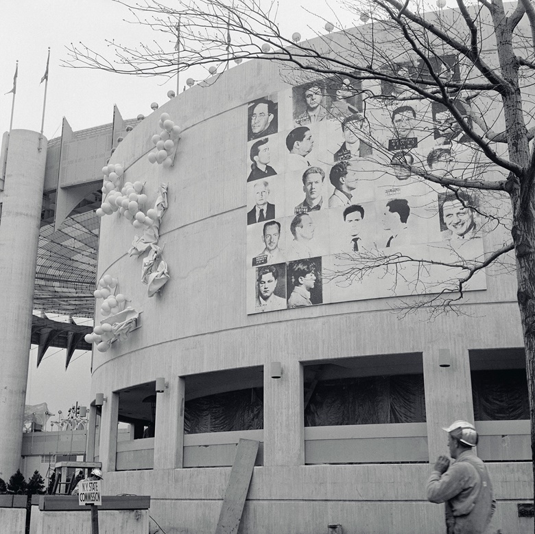 Installation view, Andy Warhol, Thirteen Most Wanted Men, 1964, New York State Pavilion, New York World’s Fair, 1964. Photo Bettmann  Contributor  Getty Images. Artwork © 2018 The Andy Warhol Foundation for the Visual Arts, Inc.  Licensed by Artists Rights Society (ARS)