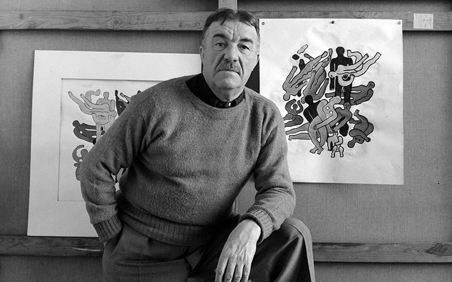 Fernand Léger as he poses in front of several of his paintings, New York, 7 October 1941. Artwork © ADAGP, Paris and DACS, London 2018. Photo Arnold NewmanGetty Images