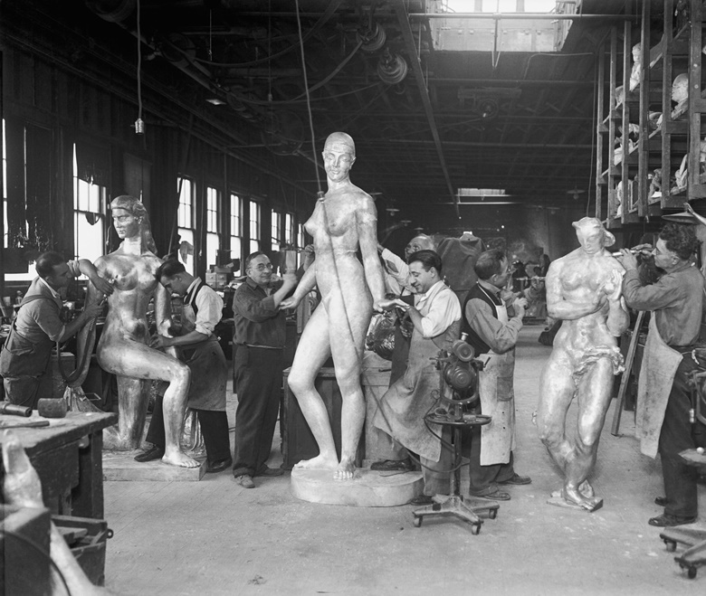 At Roman Bronze Works, New York. Staff working on sculptures for Rockefeller Center. From left William Zorach, Spirit of the Dance, Robert Laurent, Goose Girl, and Gwen Lux, Eve. Photo Getty Images. Artwork © William Zorach, LLC