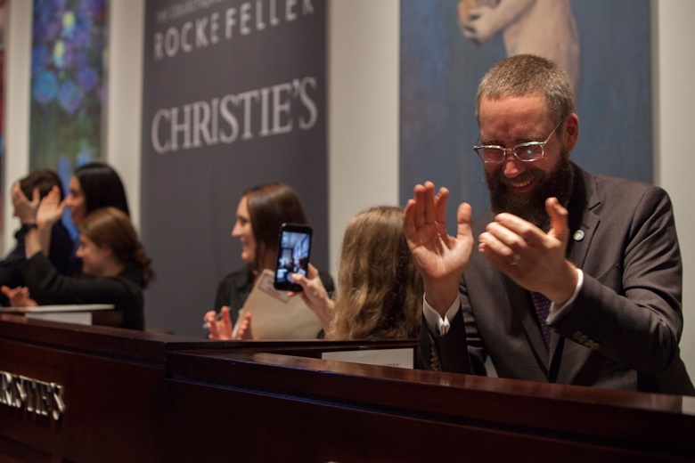 Applause as the last lot is sold in the final live auction, which finished at 2am on Friday morning