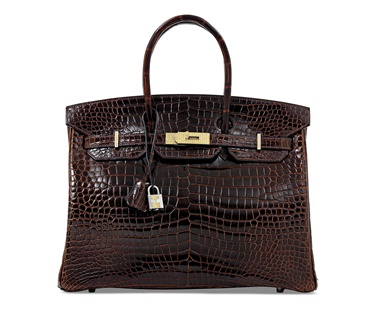 An exceptional, shiny cocoan porosus crocodile sapphire Birkin 35 with 18k white gold & yellow sapphire hardware, Hermès, 2010. 35 w x 25 h x 18 d cm. Estimate £60,000-80,000. Offered in Handbags & Accessories on 12 June at Christie’s in London
Encrusted yellow sapphires are not something you see everyday. Combine them with porosus crocodile and white gold and