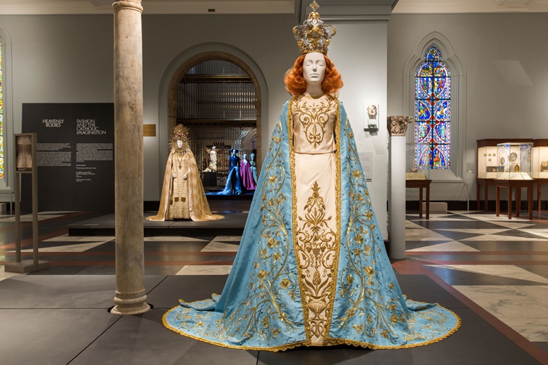 In the Medieval Europe Gallery. In the foreground, Riccardo Tisci, the Poor Benedettine Cassinesi Nuns of Lecce Statuary Vestment for the Madonna Delle Grazie, 2015 (original design, 1950). In the background Yves Saint Laurent, statuary vestment for the Virgin of El Rocío, c. 1985. Image © The Metropolitan Museum of Art