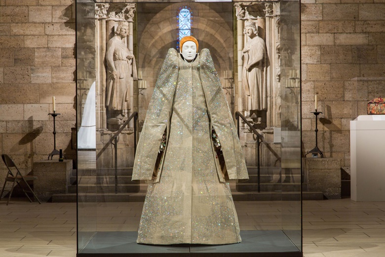 An ensemble by Viktor Horsting and Rolf Snoeren for Viktor & Rolf, from their autumnwinter 1999-2000 haute couture collection, in the Romanesque Hall. Image © The Metropolitan Museum of Art