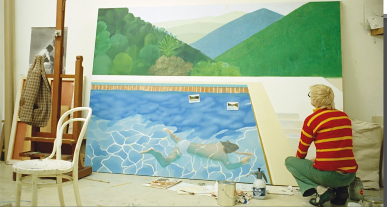 Hockney worked 18 hours a day non-stop for two weeks to finish his painting, finally completing it the night before it was due to be shipped to New York. Film still from A Bigger Splash, 1974 (present lot in progress illustrated). Photo Jack Hazan  Buzzy Enterprises Ltd. Artwork © David Hockney