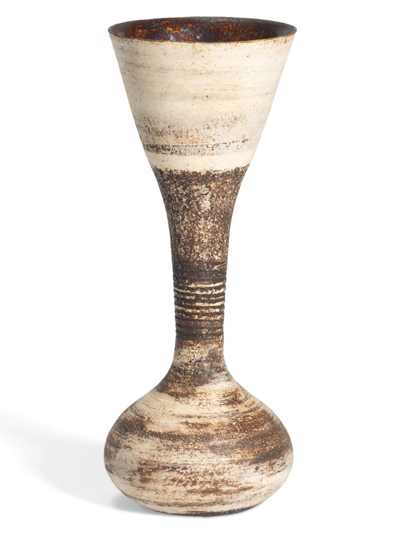 Hans Coper (1920-1981), Hourglass Vessel, circa 1970. Stoneware, layered white porcelain slips and engobes over a body with textured and incised linear designs, the interior with manganese glaze. 7½ high x 3 in diameter (19.8 x 7.5 cm). Estimate £12,000-18,000. Offered in UnBreakable on 2 October at Christie’s London