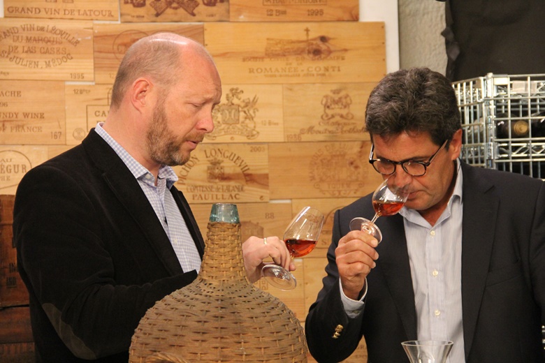 Edwin Vos of Christie&rsquo;s (left) and Francisco Albuquerque, Winemaker for the Blandys Madeira Wine Company, sample the Madeira from one of the 1820s demijohns