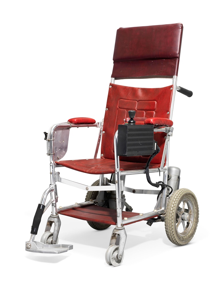 A motorised wheelchair, [Stephen Hawking]. c. 1988. Approx 127 x 58 x 72 cm. Made in England by BEC Mobility, circa 1988 (serial number 440609). Provenance from the estate of the late Professor Stephen Hawking. Estimate £10,000-15,000. This lot is offered in  On the Shoulders of Giants Newton, Darwin, Einstein, Hawking, 31 October to 8 November 2018, Online