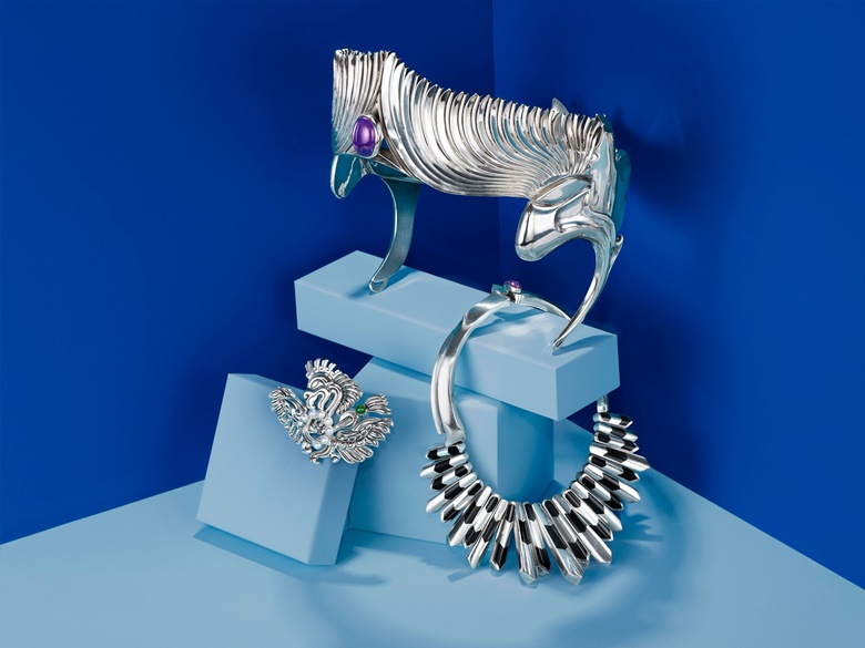 Clockwise from top an amethyst, jade and silver crown, by Antonio Pineda. Sold for $6,250. A silver and inlaid onyx necklace, by Antonio Pineda. Sold for $6,000. A jade and cultured pearl ‘Eagle’ brooch, by Antonio Pineda. Sold for $8,750. All offered in Jewels Online, 6-14 February 2019