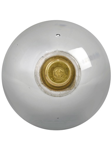 The gilt-bronze at the base of the solid glass orb — or boss — to the underside of the chandelier is signed with the Baccarat mark depicting a carafe between a wine glass and a goblet