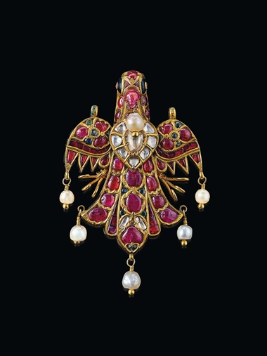 A diamond and multi-gem bird pendant with variously shaped table-cut diamonds, oval and triangular-shaped cabochon rubies and emeralds, pearls, black, blue, green, white, red and yellow enamel, foil, gold on a lac core, mid- to late-18th century