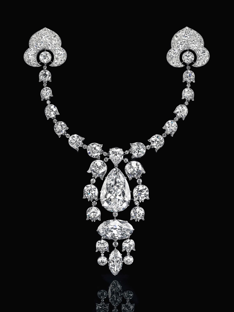 Devant-de-Corsage brooch, 1912, Cartier. Pear brilliant-cut diamond of 34.08 carats, oval brilliant-cut diamond of 23.55 carats, modified marquise brilliant-cut diamond of 6.51 carats, heart modified brilliant-cut diamond of 3.54 carats, lily-of-the-valley old-cut diamond links, platinum and 18k white gold (French marks), 7½ in, 1912. Signed Cartier