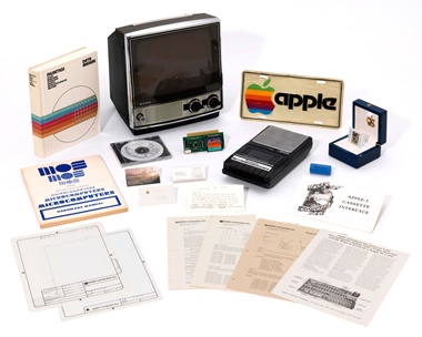 This lot includes an Apple photo slide (right, in box) of the original Apple logo that was created and drawn by Apple co-founder Ronald G. Wayne after Apple was incorporated on January 3, 1977; and a pristine, working Panasonic RQ-309DS Cassette Tape Recorder for the Apple-1
