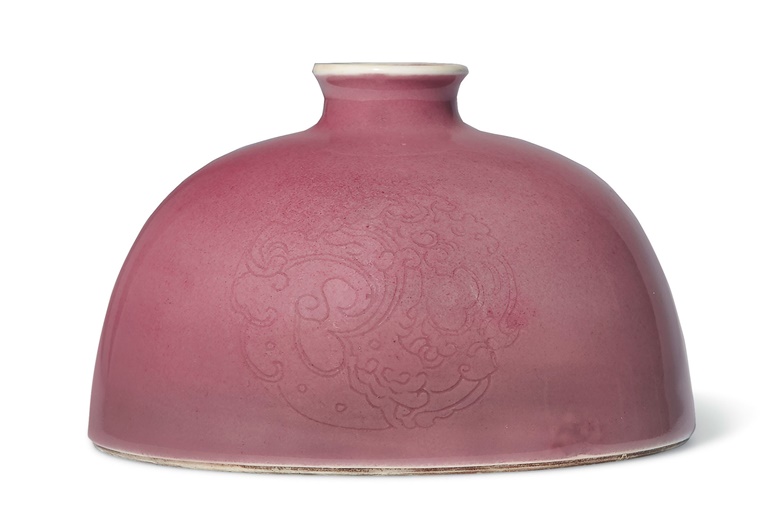 A peachbloom-glazed domed waterpot, taibai zun, Kangxi six-character mark in underglaze blue and of the period (1662-1722). 4⅞  in (12.3  cm)  diam. Estimate $80,000-120,000. Offered in Chinese Art from The Art Institute of Chicago  on 12 September 2019 at Christie’s in New York