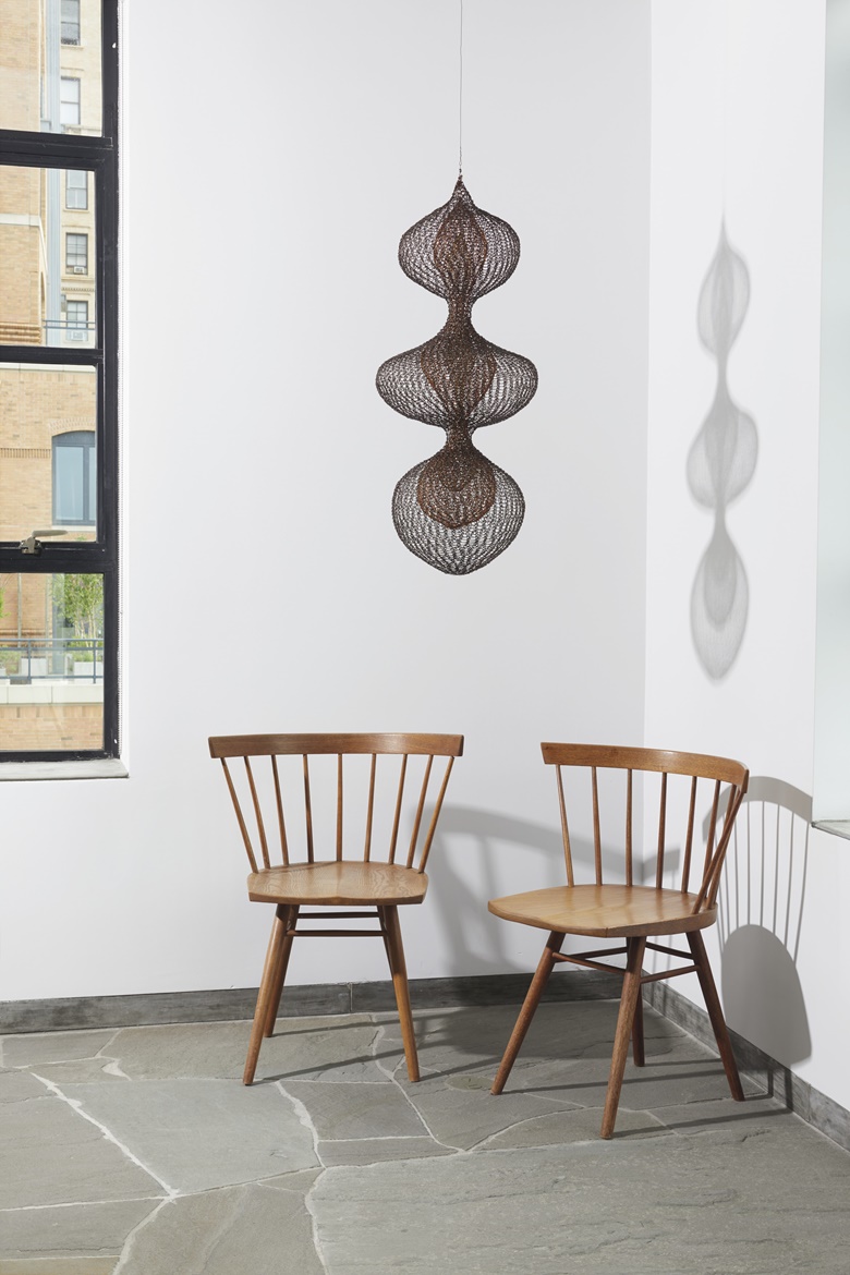 Alexander Kaplen’s home. Artwork George Nakashima (1905-1990), Two Early ‘Straight’ Chairs, circa 1947. Walnut and oak. Each 28½ in (79.4 cm) high; 24⅜ in (61.9) cm wide; 18¼ in (46.4 cm) deep. Estimate $3,000-5,000. Offered in Design on 13 December at Christie’s in New York. Ruth Asawa (1926-2013), Untitled S.387 (Three Lobed Continuous Form