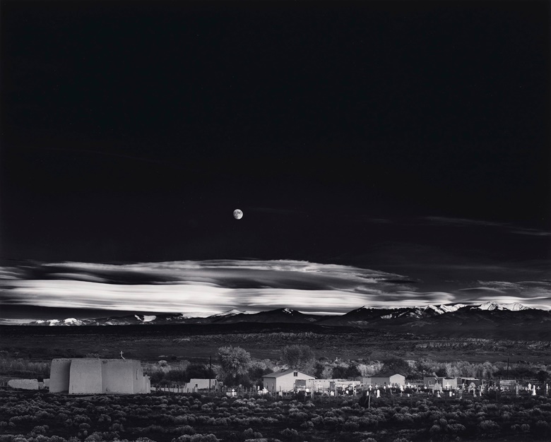 Ansel Adams (1902-1984), Moonrise, Hernandez, New Mexico, 1941. Gelatin silver print. Imagesheet 15½ x 19¼ in (39.3 x 48.9 cm). Mount 21⅞ x 27⅞ in (55.5 x 70.7 cm). Estimate $30,000-50,000. Offered in Ansel Adams and the American West Photographs from the Center for Creative Photography on 10 December 2019 at Christie’s in New York. Artwork © The Ansel Adams Publishing Rights Trust