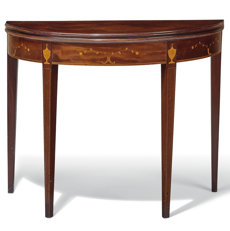 A federal inlaid mahogany demilune card table. Rhode Island, 1795-1815. Estimate $3,000-5,000. Offered in Important American Furniture, Folk Art and Silver on 24 January 2020 at Christie’s in New York