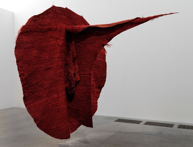 Installation view of Abakan Red, 1969, at Magdalena Abakanowicz Every Tangle of Thread and Rope, Tate Modern, London (until 21 May 2023). Tate Collection. © Magdalena Abakanowicz Foundation