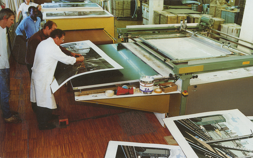At work on Richard Estes’ D-Train (1988), a monumental screenprint which was passed through the printer 112 times (see below for full image). Courtesy Domberger