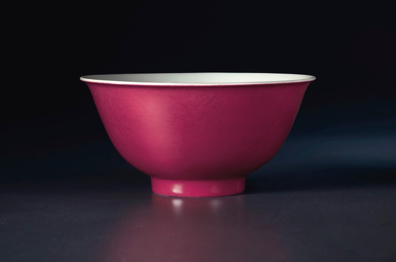 A small anhua-decorated ruby-enamelled bowl, Qing dynasty, Yongzheng four-character mark underglaze blue within a double square and of the period (1723-1735). 3⅞ in (9.6 cm) diameter. Estimate $100,000-150,000. Offered in Sacred and Imperial The James and Marilynn Alsdorf Collection Part I on 24 September at Christie’s in New York