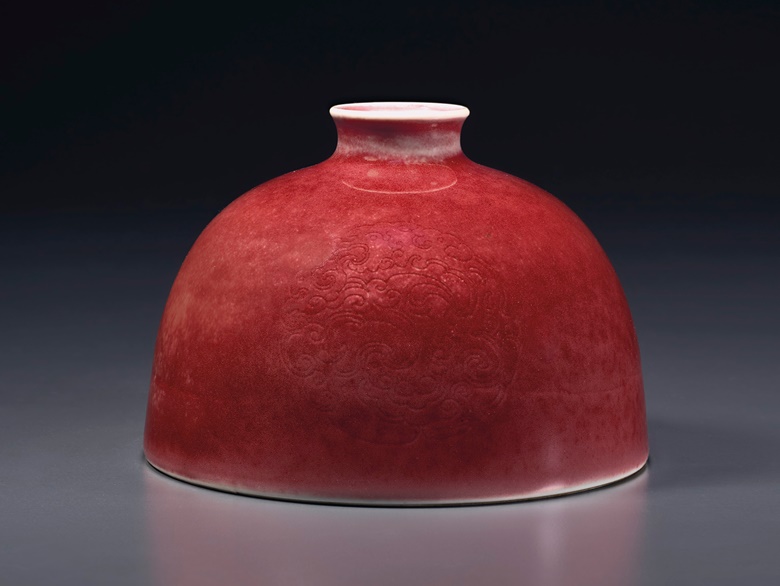 A superb peachbloom-glazed water pot, taibai zun, Kangxi six-character mark in underglaze blue and of the period (1662-1722). 4⅞ in (12.4cm) diameter. Estimate $150,000-250,000. Offered in Sacred and Imperial The James and Marilynn Alsdorf Collection Part I on 24 September at Christie’s in New York