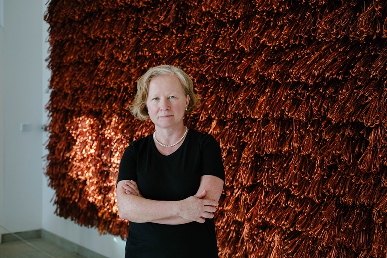 Maya Allison photographed at the Art Gallery at NYU Abu Dhabi with Hassan Sharif, Copper Wire, 2015 (detail). Photo Anna Nielsen. Artwork Hassan Sharif, Copper Wire, 2015. Copper, 244 x 530 x 35 cm. NYU Abu Dhabi Campus Art Collection