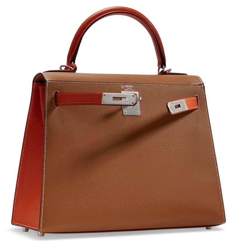 A custom gold & feu Epsom leather Sellier Kelly 28 with brushed palladium hardware, 2017. W 28 x H 22 x D 10 cm. Price on request. View Handbags currently offered for private sale at Christie’s