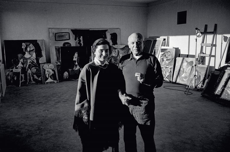 Pablo Picasso and Jacqueline at Notre-Dame-de-Vie, Mougins, 1962, with the present lot visible behind them. Photograph by Edward Quinn. Photo Edward Quinn, © edwardquinn.com. Artwork © Succession PicassoDACS, London 2021