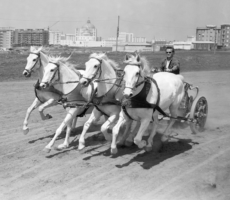 Rome, May 1958. Charlton Heston takes a spin in a four-horse chariot, while training for the big chariot racing scene in the film Ben-Hur. Photo Bettmann  Getty Images