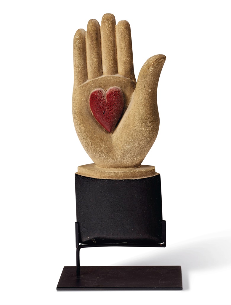 A carved and painted wood heart-in-hand lodge symbol, American, late 19th century. 9 in high. Sold for $13,750 on 22 January 2021 at Christie’s in New York