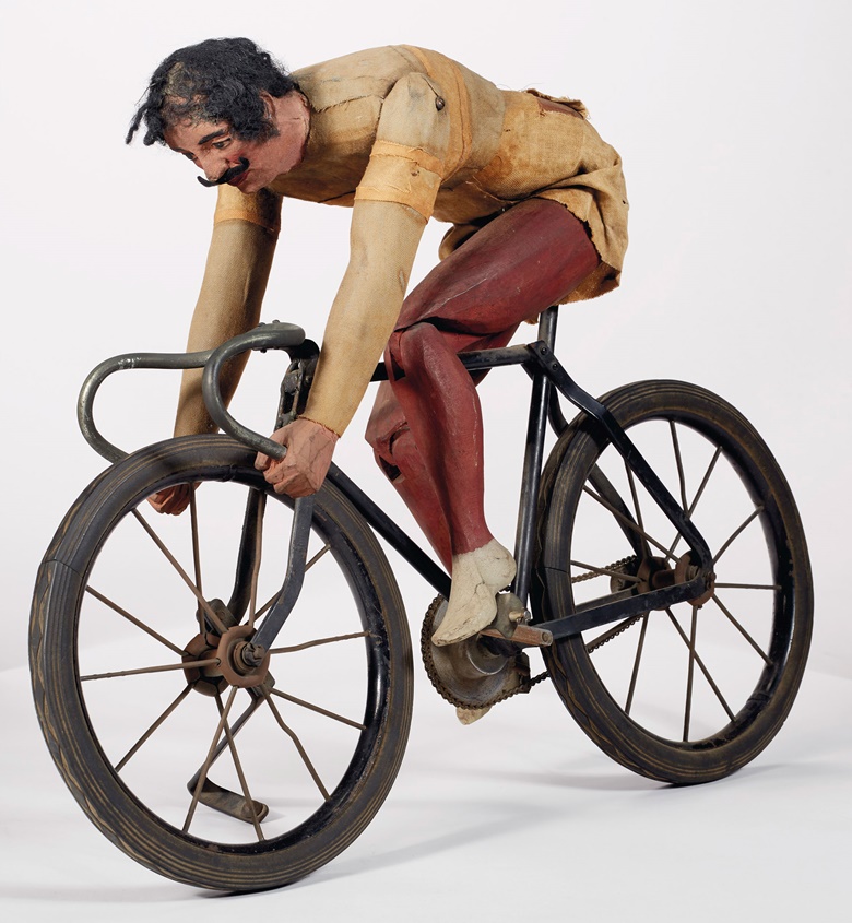 An articulated painted pine and fabric cyclist, probably New York City, early 20th century. 21¼ in long, 15½ in high, 4¾ in wide. Sold for $13,750 on 22 January 2021 at Christie’s in New York