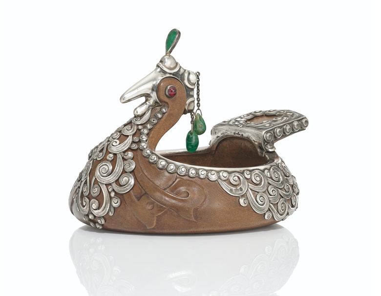 A gem-set silver-mounted hardwood kovsh, by Fabergé, Moscow, 1908-1917. 5½ in (14 cm) long. Sold for £60,000 on 29 November 2021 at Christie’s in London