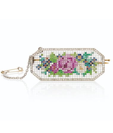 An important jewelled gold and platinum mosaic brooch, by Fabergé, St Petersburg, circa 1913. 1⅝ in (4.3 cm) long. Sold for £350,000 on 29 November 2021 at Christie’s in London
