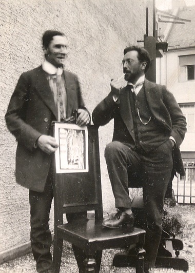 Franz Marc and Wassily Kandinsky with the cover design for Der Blaue Reiter, Munich, 1911. Photo Gabriele Münter. Gabriele Münter- und Johannes Eichner-Stiftung, München. © DACS 2022