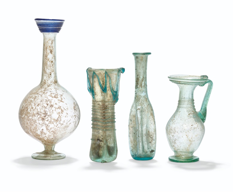 Four Roman glass vessels, circa 2nd-5th century AD. 6⅞ in (17.6 cm) high max. Sold for £5,250 on 8 December 2021 at Christie’s in London