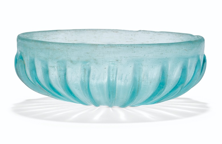 A Roman pale blue glass pillar-moulded bowl, circa 1st century BCAD. 5⅛ in (13 cm) diameter. Sold for £10,625 on 8 December 2021 at Christie’s in London