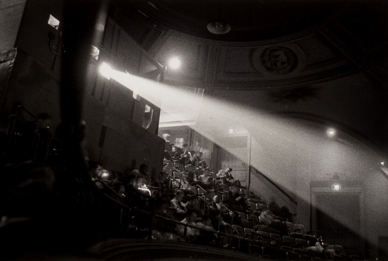 Diane Arbus (1923-1971), 42nd street Movie theater audience, N.Y.C., 1958. Gelatin silver print, flush mounted on board. Imagesheetflush mount 6½ x 9⅞ in (16.5 x 25 cm). Estimate $25,000-35,000. Offered in Photographs from the Richard Gere Collection on 23 March-7 April 2022 at Christies Online