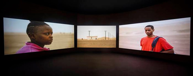 In the Ghana Pavilion at the 2019 Venice Biennale. John Akomfrah, Four Nocturnes, 2019. Three channel HD colour video installation, 7.1 sound. 50 minutes. © Smoking Dogs Films. Courtesy Smoking Dogs Films and Lisson Gallery. Photo © David Levene  Guardian  eyevine