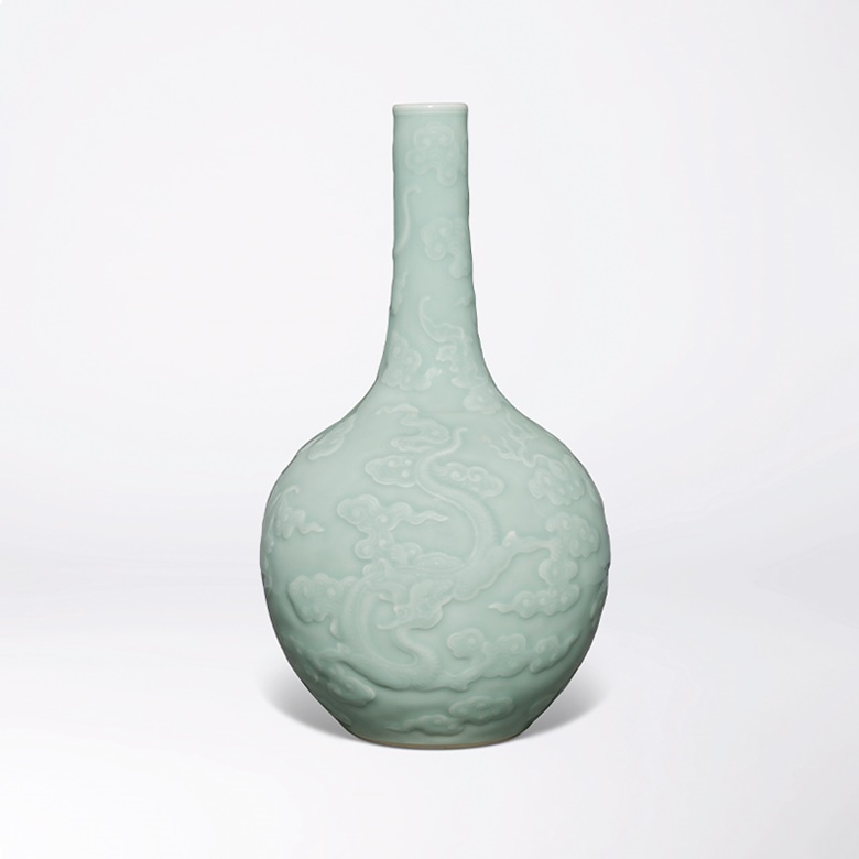 A very rare and finely carved celadon-glazed ‘Dragon’ bottle vase. Qianlong-incised six-character seal mark and of the period (1736-1795). 28.3 cm (11⅛ in) high. Estimate HK$10,000,000-18,000,000. Offered in Celestial Brilliance - The Wang Xing Lou Collection of Imperial Qing Dynasty Porcelain on 30 May at Christie’s in Hong Kong