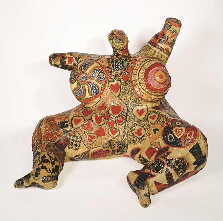 Niki de Saint Phalle, Seated Nana, 1965. Painted polyester resin, fabric, wire mesh, and collage. 39⅜ × 55⅛ × 55⅛ in (100 × 140 × 140 cm). Private collection, Courtesy Niki Charitable Art Foundation, Santee © Niki Charitable Art Foundation. All rights reserved. Photo Laurent Condominas