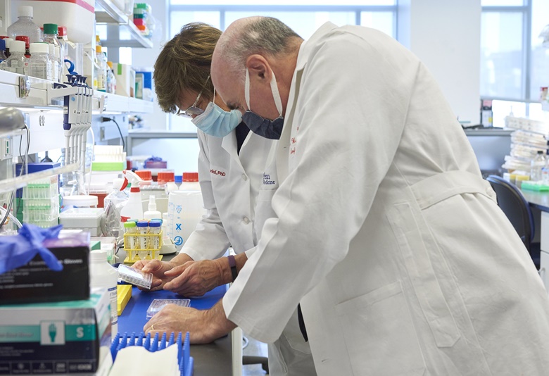 Dr. Drew Weissman and Dr. Katalin Karikó at the Weissman Lab, University of Pennsylvania. Photo by Peggy Peterson. Courtesy of Penn Medicine