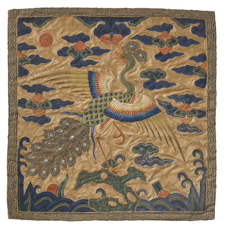 A rare embroidered gold-ground rank badge of a peacock, buzi,  Kangxi period (1662-1722). 13 ½ x 13 ¼ in (34.5 x 33.8 cm). Estimate $18,000-25,000. Offered in Important Chinese Ceramics and Works of Art from 22-23 September 2022 at Christies in New York